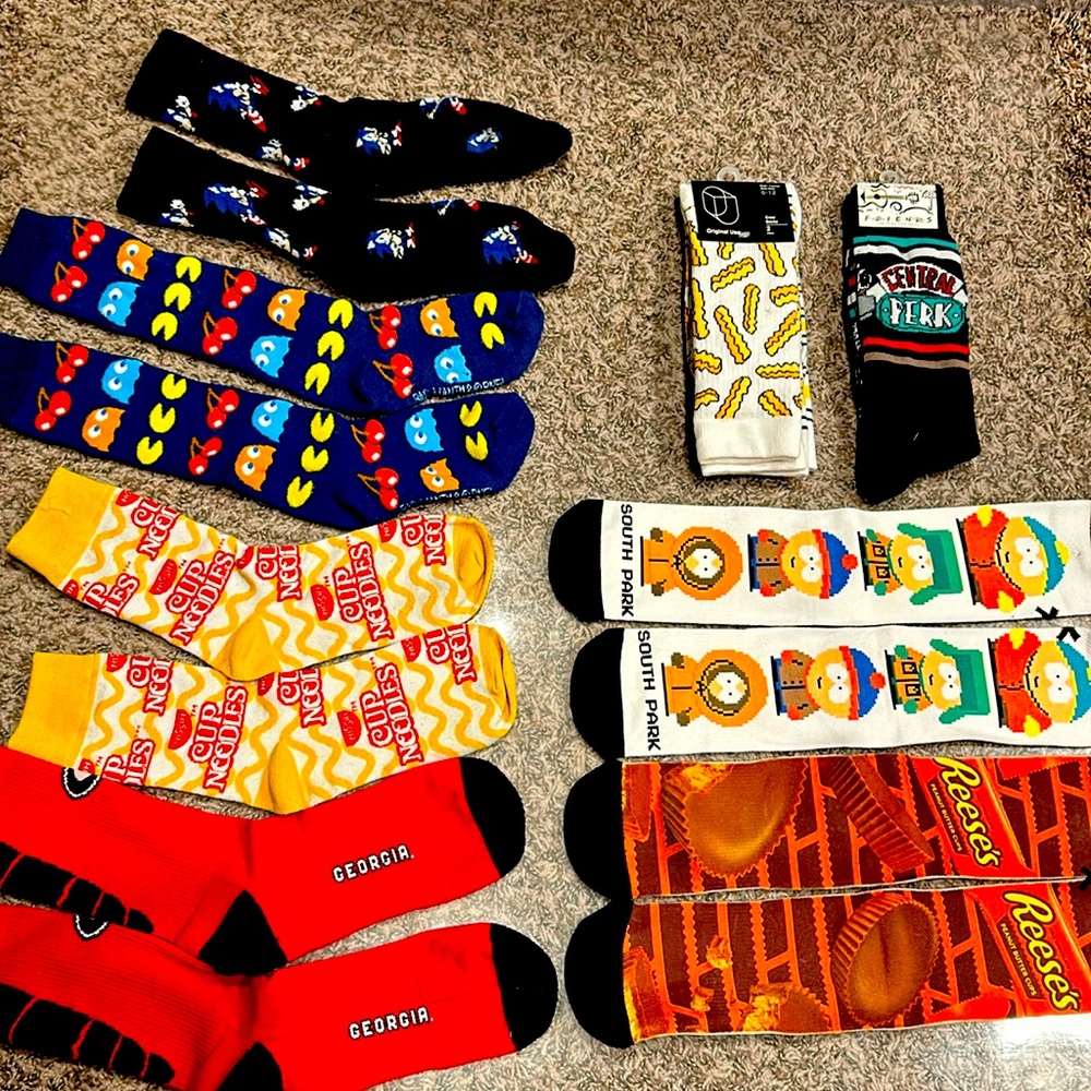 Assorted themed crew socks. Shoe sizes 6-12